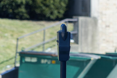 Close-up of camera on railing