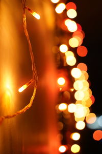 Close-up of illuminated christmas lights at night
