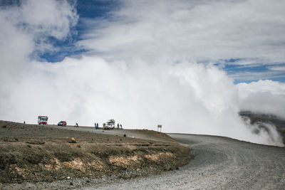 Scenic view of landscape against cloudy sky