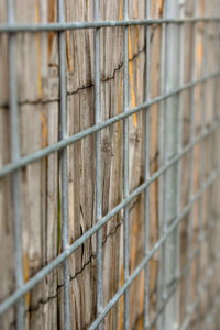 Full frame shot of fence against wall