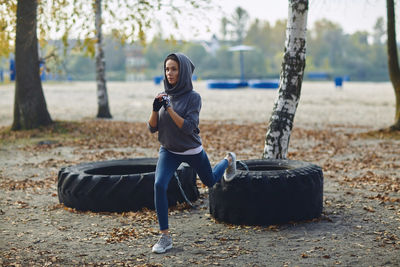 Full length of woman exercising at park