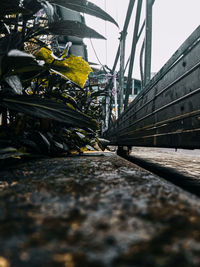 Surface level of bridge against sky in city