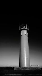 Low angle view of lighthouse against sky at night