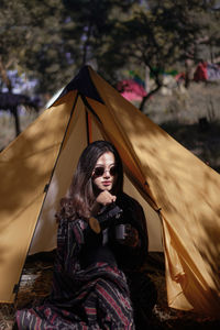 Portrait of woman sitting outdoors