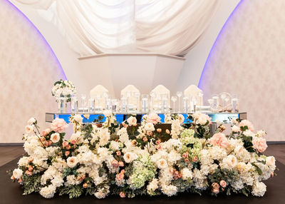 Midsection of woman with flowers