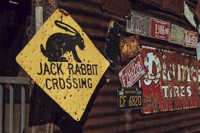 Close-up of information sign on corrugated iron