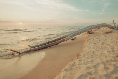 Scenic view of beach against sky during sunset