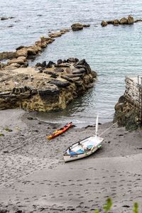 High angle view of boats moored on shore at beach