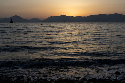 Scenic view of sea against sky during sunset