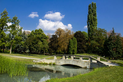 Bridge over park against sky