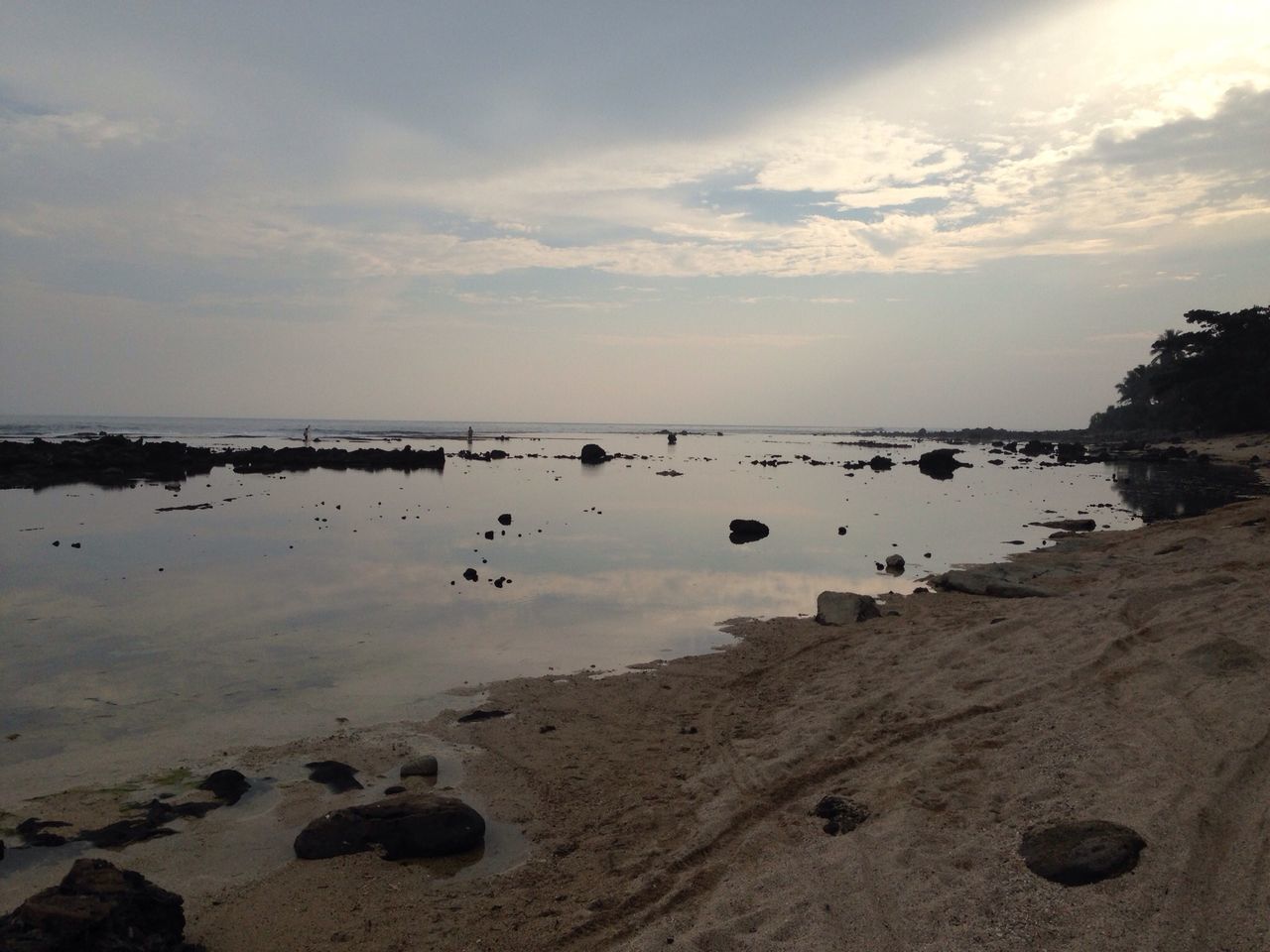 sea, water, beach, sky, shore, horizon over water, scenics, tranquil scene, tranquility, beauty in nature, sand, cloud - sky, nature, idyllic, coastline, cloud, rock - object, cloudy, outdoors, incidental people