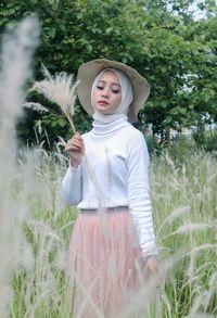 Full length of woman standing on field