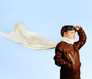 Low angle view of man standing against clear sky