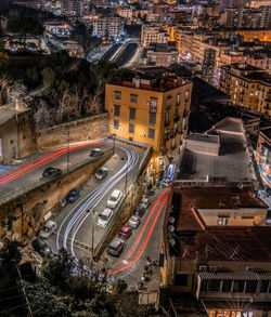 High angle view of light trails on road in city