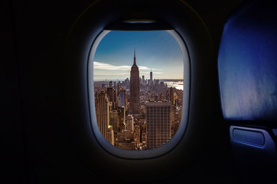 Buildings in city seen through window