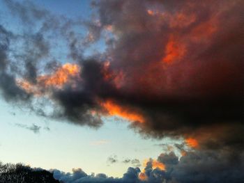 Low angle view of dramatic sky during sunset
