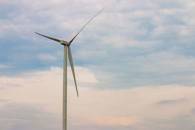 Low angle view of wind turbine against sky