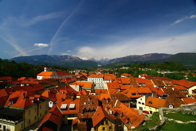 High angle view of houses in town against sky