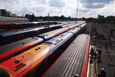 High angle view of train at railroad station against sky