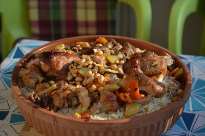 Close-up of rice casserole with turkey in plate on table