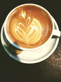 High angle view of cappuccino on table