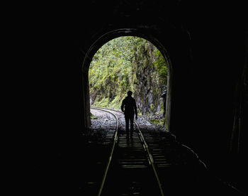 Hiker on train tracks that lead up to aguas calientes