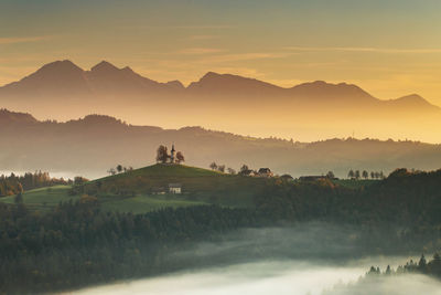 Scenic view of mountains against sky during sunset