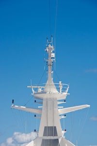 Low angle view of sailboat against clear blue sky