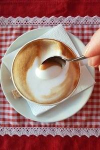 High angle view of coffee cup on table