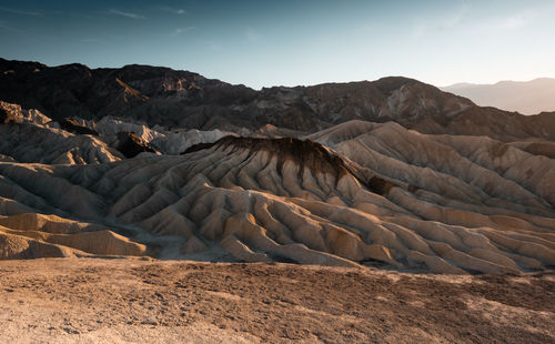 Scenic view of arid landscape against clear sky