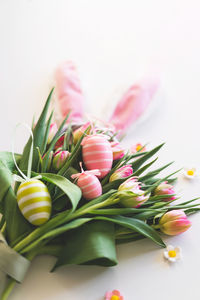 Happy easter. stylish dyed easter eggs with spring flowers