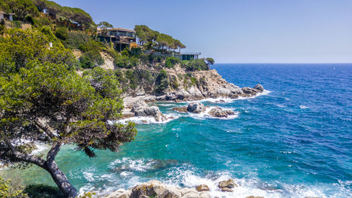 Scenic view of sea against clear blue sky