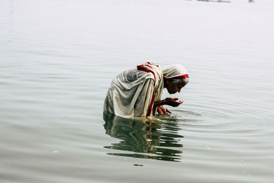 Man swimming in lake