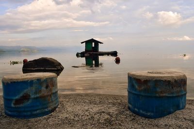 Lifeguard hut on beach against sky