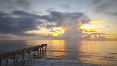 Scenic view of sea against sky at sunset