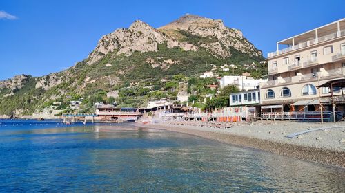 Scenic view of sea against clear blue sky
