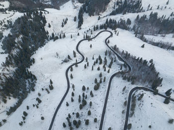 High angle view of road on snow covered land