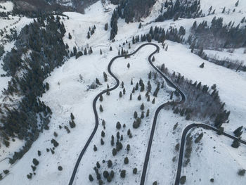 Long winding rural road with snow