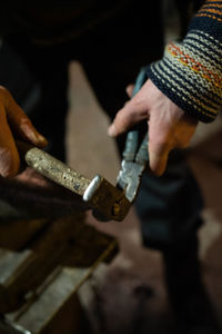 Cropped hands of man working at workshop