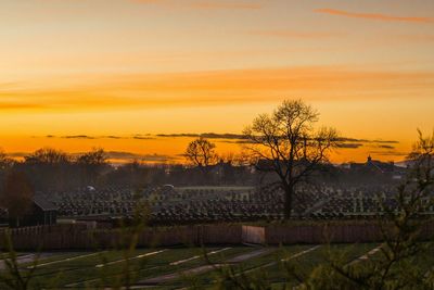 Scenic view of landscape against sky at sunset