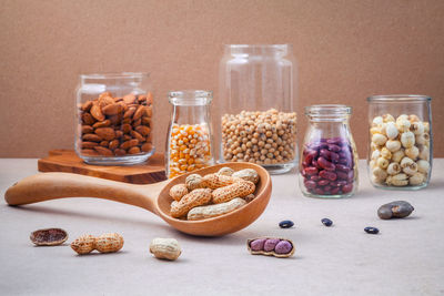 Variety of food in glass jars on table