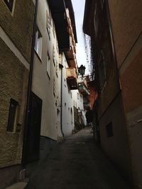 Alley amidst houses in town