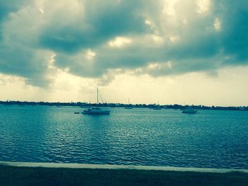 Scenic view of sea against cloudy sky