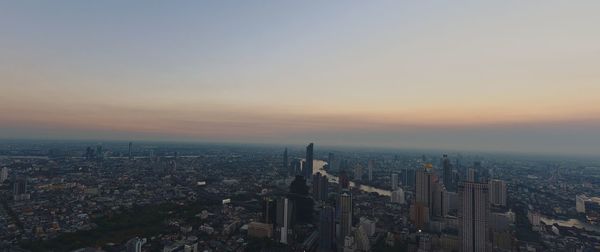 High angle view of buildings against sky during sunset