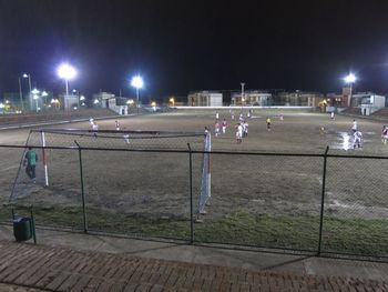 View of illuminated street lights at night