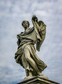 Low angle view of statue against sky