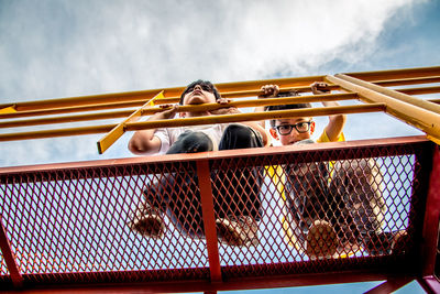 Portrait of boys on outdoor play equipment