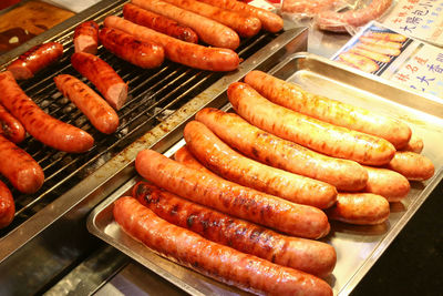 High angle view of meat on barbecue grill