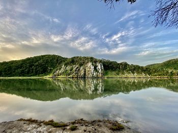 Scenic view of lake and trees against sky