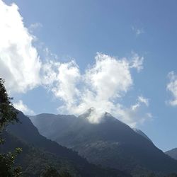 View of clouds over mountain range